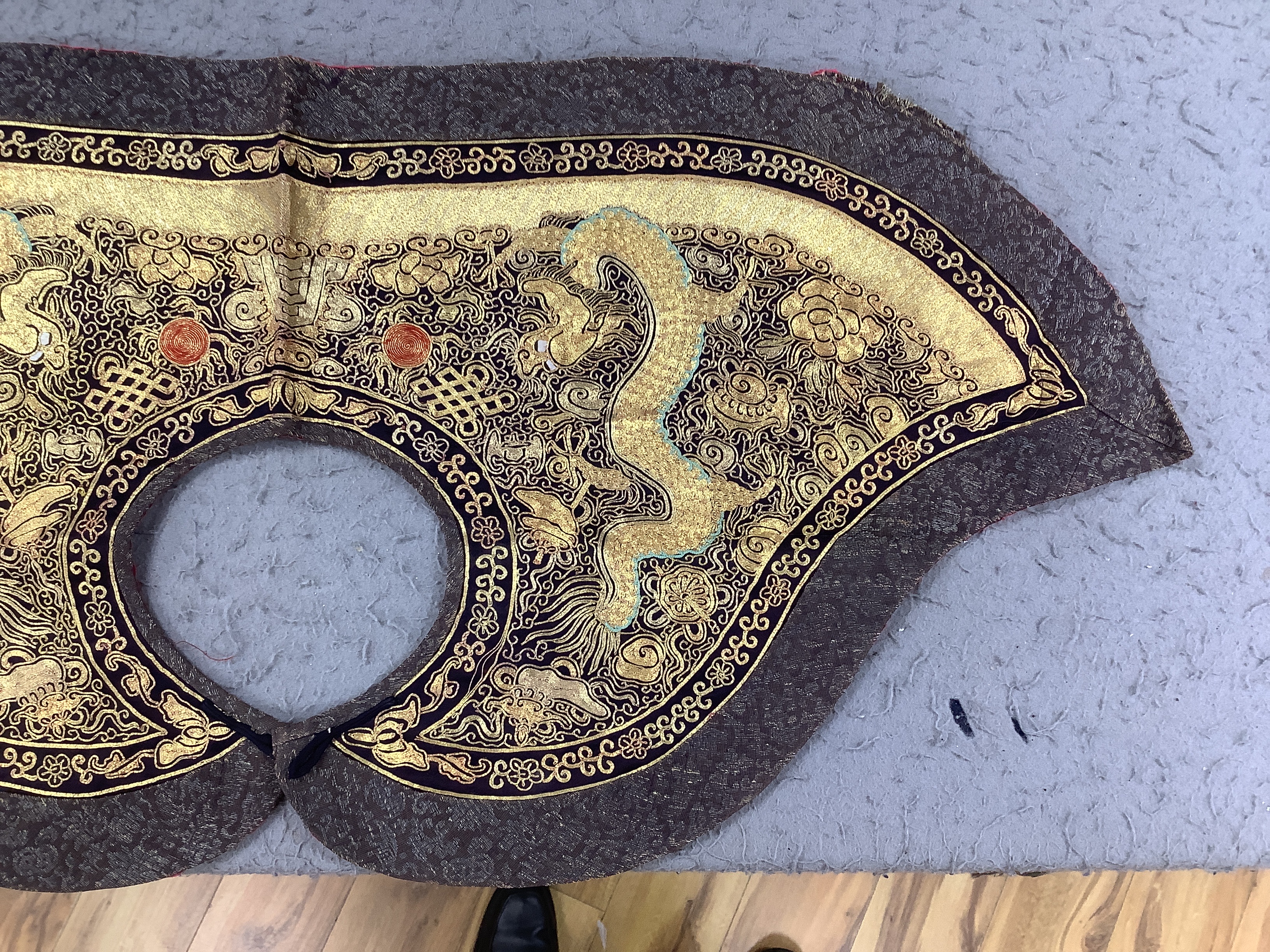 Two mid 20th century Chinese embroidered Rank Badges, a large gold thread dragon embroidered collar, three Chinese embroidered panels and a Japanese 1930’s Shantung silk dragon embroidered Kimono dressing gown